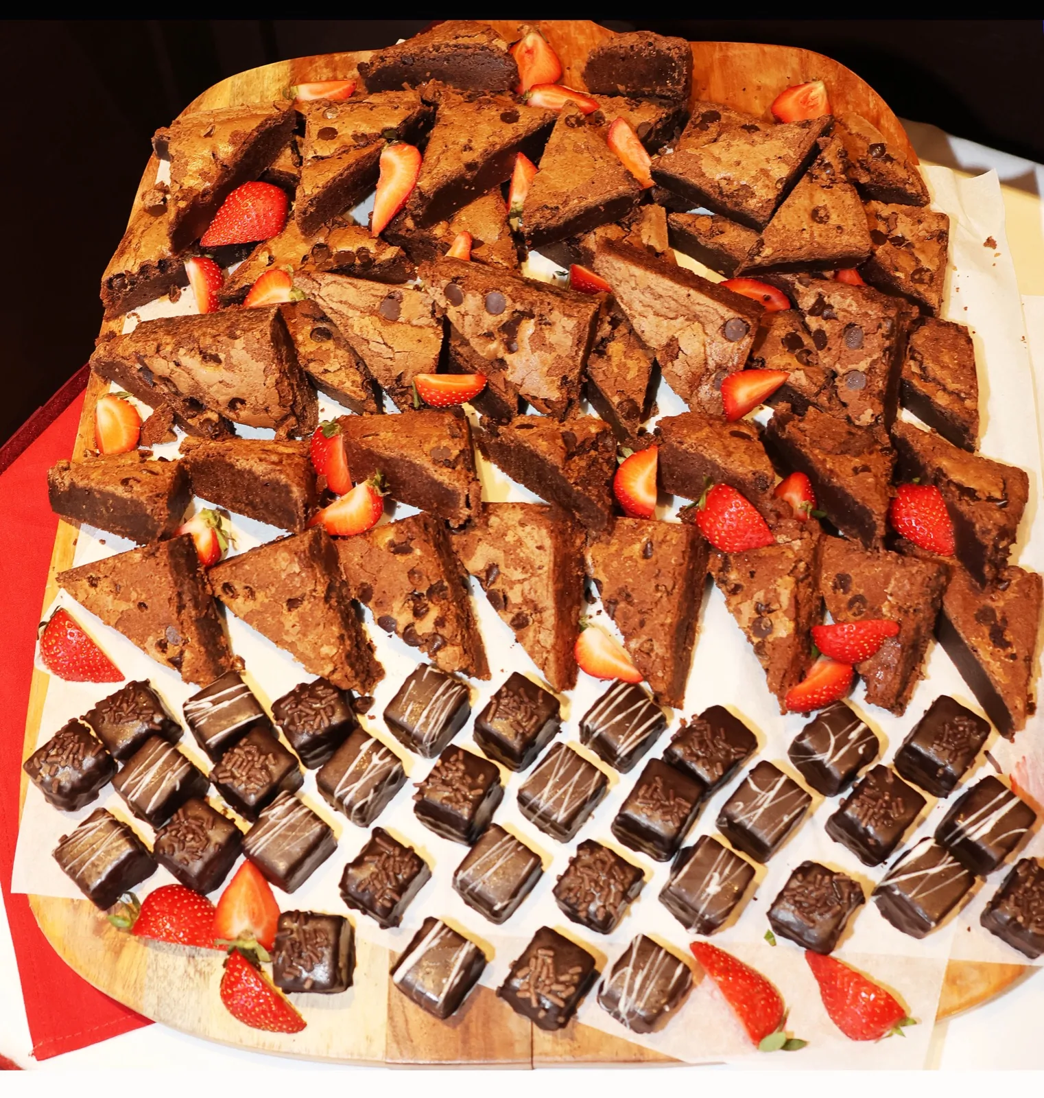 Sunday brunch dessert board of brownies, chocolate petit fours, and strawberries at The Venue Clermont